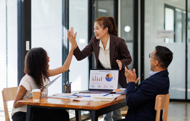 Group of  businesspeople or team creative businesspeople coworker in office Happy to be successful partnership teamwork celebrating achievement and success concept.
