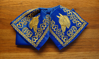 closeup of embroidered Mexican Charro or Mariachi outfit bow tie