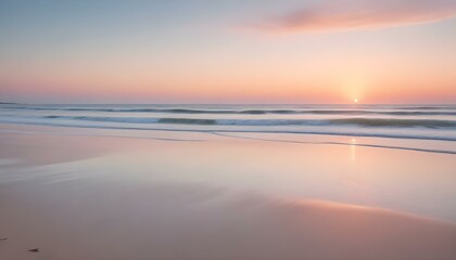 Fototapeta premium A panoramic view captures a serene beach scene at what appears to be either sunrise or sunset, characterized by a soft, pastel color palette
