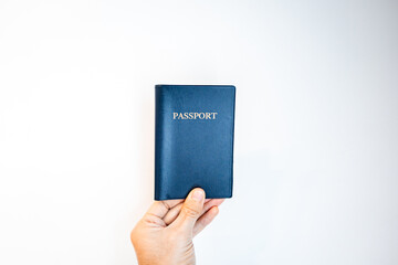 Passport close-up held in hand. generic passport with blank background