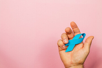 Promoting awareness for cancer through symbolic blue ribbon display