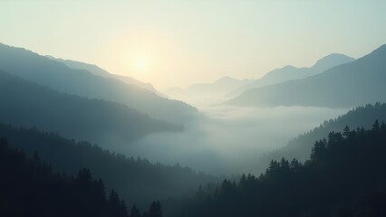 Misty forested mountains layered in morning fog with soft sunrise in the background	