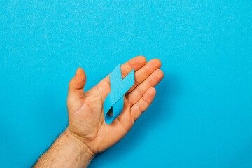 Promoting cancer awareness with a blue ribbon for support and hope