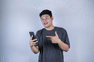 Man experiencing a headache, stressed expression. Studio shot of a man with a distressed expression, holding his head in pain.