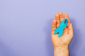 Blue ribbon symbolizes hope in cancer awareness campaign for men