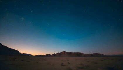 Naklejka premium night sky with stars above a desert landscape