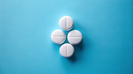 Minimalist Medical Cross with White Pills on Blue Background for Health and Wellness Imagery