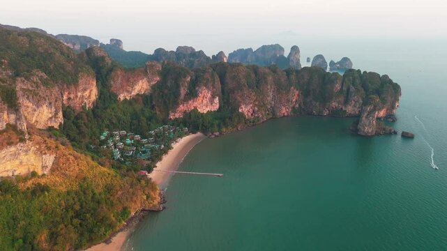 Aerial drone fly paradisaical landscape of Ao Nang Thailand, beach Krabi, natural tropical cliffs over blue water