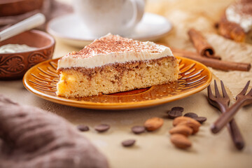 Homemade gluten free almond and cinnamon cake with cup of coffee