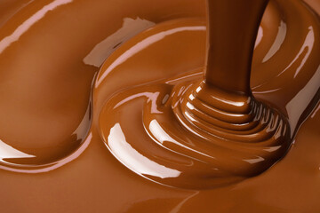 splash of melted chocolate. sweet cocoa dessert, dark chocolate background