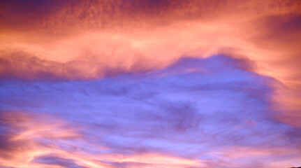 Background atmosphere of the blue sky accompanied by fluffy clouds at sunset