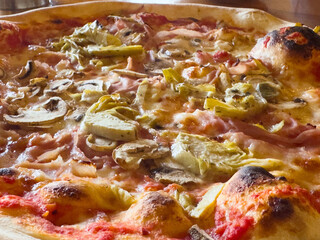 Delicious artichoke and mushroom pizza with melted cheese and crispy crust