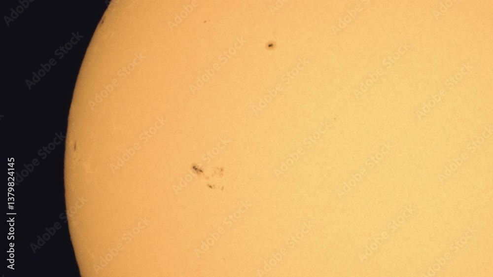 Sticker surface of the sun through telescope with visible sunspots and surface texture and atmosphere turbul