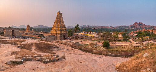 sunset panoramic view amazing temple complex at Hampi, world famous unesco site, ancient stone walls and mysterious gateways in Karnataka, India