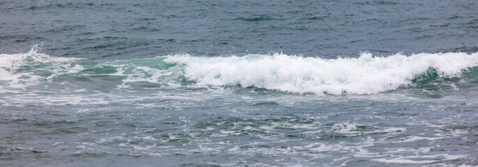 The ocean is calm and the waves are small