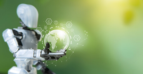 Robot holding a glowing earth globe against a blurred green background.