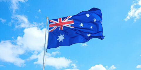 Australian flag waving in blue sky. Celebrate Australian independence day and Republic day, National pride, Patriotism, and Freedom.