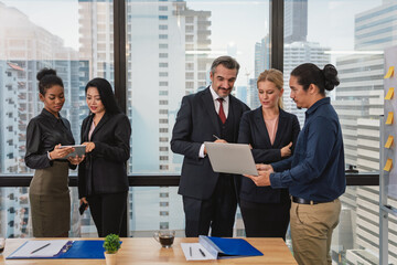 Business people or team with laptop in office for meeting,Multicultural professional businesspeople working together on research plan in boardroom.