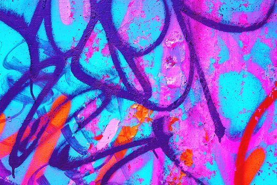 Fototapeta Vibrant graffiti abstract in neon pink, orange, blue with bold strokes. 80s urban art, street style, fluorescent vibes. Modern 90s, 2000s creative banner, digital art, urban designs.
