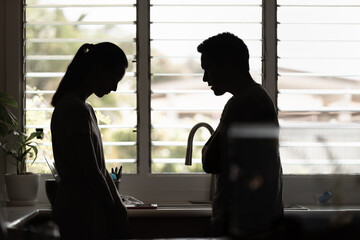 unhappy crying frightened woman, aggressive man quarreling at home. Angry husband emotionally arguing screaming shouting to scared wife psychological emotional abuse, domestic violence relationship	