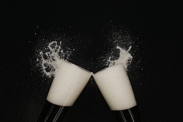 Cheers to the Moment: Two glasses of effervescent beverage clink together in celebration, a cascade of foamy bubbles erupting into the air, creating a moment of joy and togetherness.