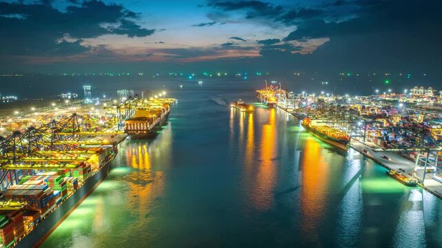 Time lapse of Container ship loading and unloading in port.