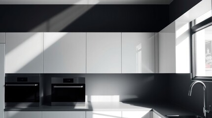 Modern kitchen with white cabinets and dark accents. Sunlight streams in through window