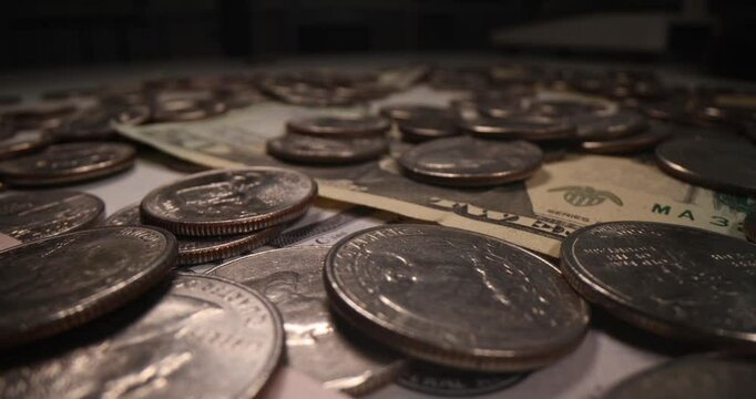 Silver coins and paper bills lie hidden in sturdy safe. Collection of money in dollar currency stored in secure place creating mystery atmosphere