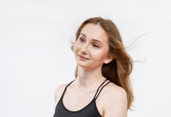 Fototapeta premium Portrait of a woman in a T-shirt on a light background.