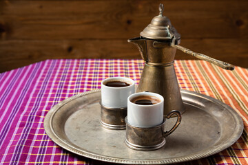 still life with a middle eastern coffee set, on wooden table