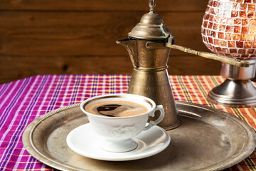 still life with a middle eastern coffee set, on wooden table