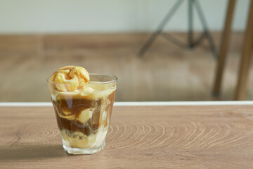 Affogato coffee with vanilla ice cream and shot of espresso. Classic Italian coffee and dessert combination,  copy space for the text.