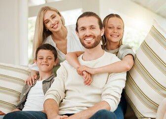 Obraz premium Home, happy children or portrait of family with parents on sofa for love, care or boy bonding with girl. Face, mother and father with kids on couch or siblings hug for support in living room together