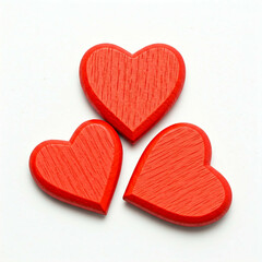 Obraz premium three red wooden hearts on white background