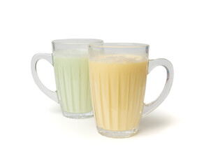 Vanilla milk shake in glass. Milkshake on yellow background, white whey protein smoothie