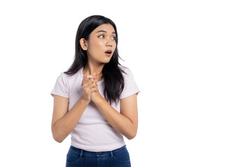 Young Asian woman looking surprised and worried, clasping her hands together, isolated on transparent background