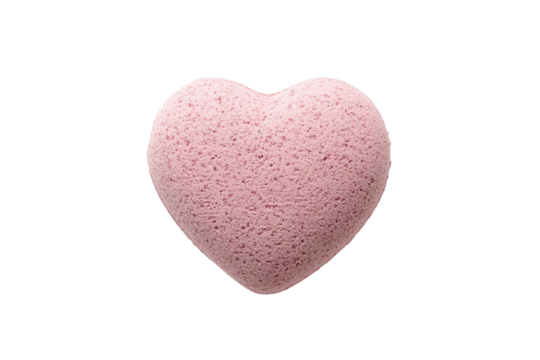 Soft pink heart-shaped bath bomb resting on a white background invites relaxation and self-care