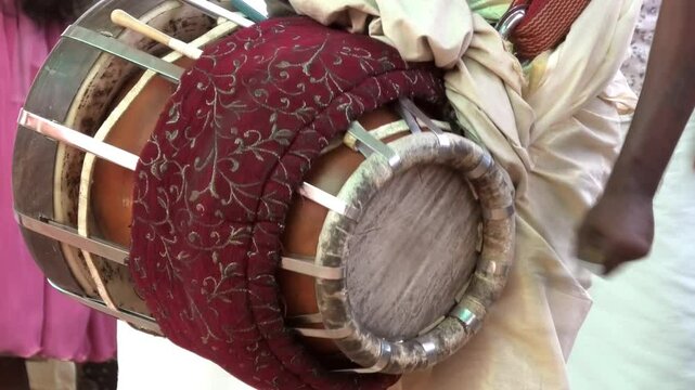 Artist playing Thavil, a South Indian percussion musical instrument