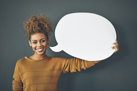 African woman, portrait and speech bubble in studio with mockup space for advertising and marketing. Female person, voice and quote on gray background for social media, feedback and news announcement - Powered by Adobe