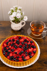 Berry pie and tea on the table. Dessert for tea. Berry pie. Strawberry pie