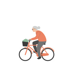 Obraz premium Elderly woman riding a bicycle with a basket of vegetables 