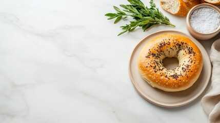 A single keto-friendly bagel rests on a ceramic plate, accompanied by fresh herbs. The light marble countertop adds elegance and empty space invites creativity