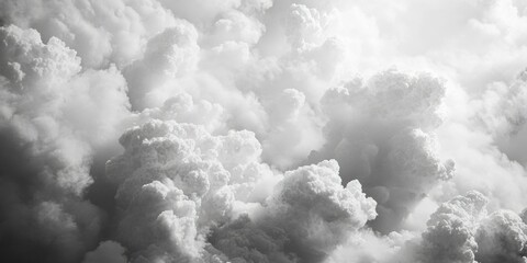 Dark and light grayscale image of cloudy sky, showing a dramatic contrast between the two halves.