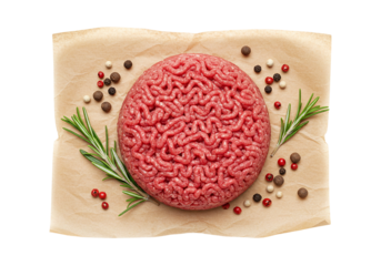 Raw ground beef patty seasoned rosemary peppercorns parchment paper, top view isolated white. Fresh ground meat shaped perfectly for gourmet burger, premium quality ground beef ready for cooking.