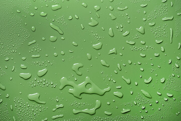 Drops of water on green background. Form and movement.