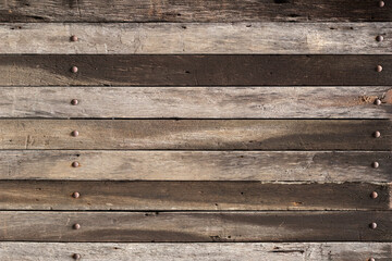 Empty dark brown plank old wooden board background. Beautiful texture and pattern panels from reused pines wood pallet.