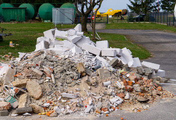 unorganized construction waste lying on the construction site. scattered rubble and bricks