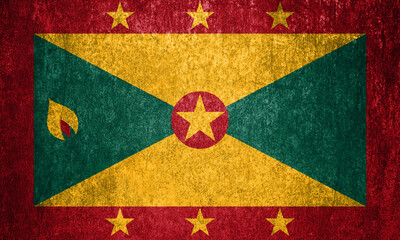 Grenada state flag on a metal surface. Dirty grunge Grenada flag.
