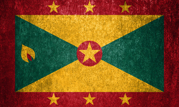 Grenada state flag on a metal surface. Dirty grunge Grenada flag.