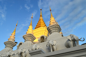 Golden Pagoda, Lanna Architecture in Evening vibes with natural landscapes at Wat Pa Ratchadaram in...